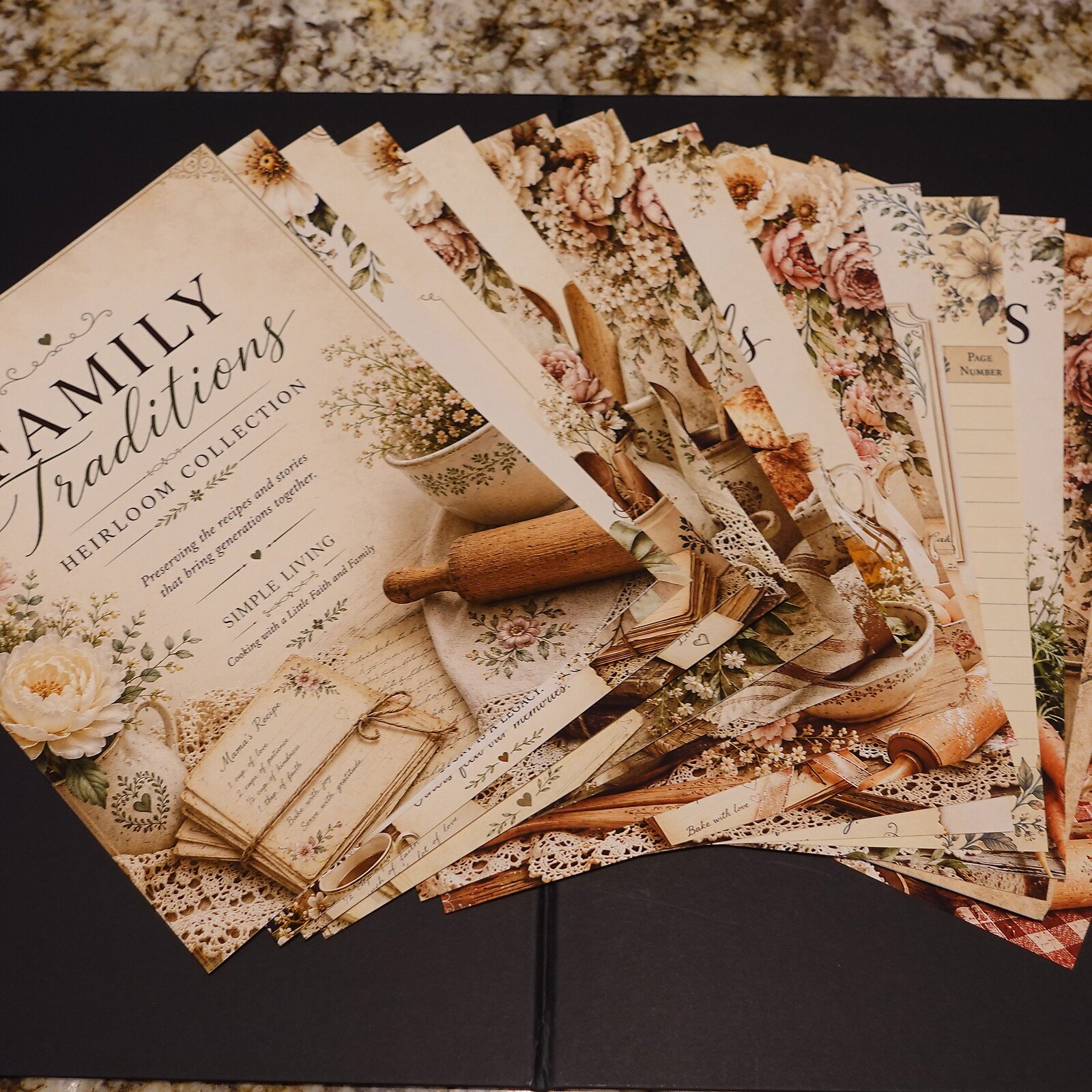 07-pages-fanned - Simple Living Faith Flower-themed heirloom collection pages fanned out on a dark surface, showing vintage typography and floral borders for crafts or scrapbooking.